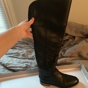 Tall black leather boots